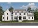 Elegant two-story home featuring painted brick, a symmetrical facade, and lush landscaping at 6844 Greystone Dr, Raleigh, NC 27615