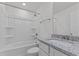 Clean bathroom with granite counter, sink, and a bathtub and shower at 945 Alma Railway Dr # 559, Wake Forest, NC 27587