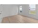 Bright, airy bedroom features beautiful floors, large windows and ample natural light at 945 Alma Railway Dr # 559, Wake Forest, NC 27587