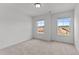 Bright bedroom with two windows and neutral-colored carpeting at 945 Alma Railway Dr # 559, Wake Forest, NC 27587