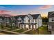 Beautifully landscaped townhome with covered entryway and welcoming brick accents at 945 Alma Railway Dr # 559, Wake Forest, NC 27587