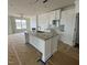 Open concept kitchen with white cabinets, granite island, and stainless steel appliances at 945 Alma Railway Dr # 559, Wake Forest, NC 27587