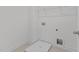 Functional laundry room with tile floor, shelf, and hookups, providing a convenient space for chores at 945 Alma Railway Dr # 559, Wake Forest, NC 27587