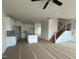 Open floor plan with modern kitchen, staircase, and plenty of natural light at 945 Alma Railway Dr # 559, Wake Forest, NC 27587