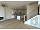 Spacious living area featuring a fireplace, open kitchen, and abundant natural light at 945 Alma Railway Dr # 559, Wake Forest, NC 27587