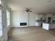 Open-concept living area with fireplace and modern kitchen design, great for entertaining at 945 Alma Railway Dr # 559, Wake Forest, NC 27587