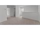 Open loft area with neutral carpet and views of multiple doorways at 945 Alma Railway Dr # 559, Wake Forest, NC 27587