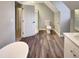 Modern bathroom with a glass shower, toilet and vanity with a large mirror at 101 Madeline Ct, Youngsville, NC 27596
