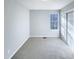 Bedroom featuring carpet flooring, neutral walls, a window and closet space at 101 Madeline Ct, Youngsville, NC 27596