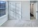 Bright bedroom featuring a double door closet and natural light from a window at 101 Madeline Ct, Youngsville, NC 27596