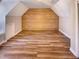 Bonus room featuring a wood accent wall and hardwood flooring at 101 Madeline Ct, Youngsville, NC 27596