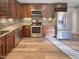 Well-equipped kitchen features stainless steel appliances, granite countertops, and ample cabinet space at 101 Madeline Ct, Youngsville, NC 27596