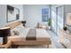 This virtually staged bedroom features a comfortable bed, modern decor, and a bright window at 101 Madeline Ct, Youngsville, NC 27596