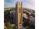 Magnificent aerial view of Duke Chapel, showcasing its Gothic architecture and surrounding landscape at 1021 Prominence Dr., Homesite 20, Durham, NC 27712