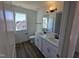 Modern bathroom featuring double sinks, quartz countertops, and sleek black fixtures at 1021 Prominence Dr., Homesite 20, Durham, NC 27712