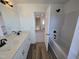 Bathroom featuring double sinks, quartz countertop, and tub-shower combo at 1021 Prominence Dr., Homesite 20, Durham, NC 27712