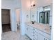 Elegant bathroom featuring double vanity, marble floors, and walk-in shower with glass door at 1021 Prominence Dr., Homesite 20, Durham, NC 27712