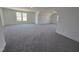 Large bonus room featuring plush carpeting, a large window, and natural light at 1021 Prominence Dr., Homesite 20, Durham, NC 27712