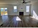Bright and spacious living room with a fireplace and access to the deck at 1021 Prominence Dr., Homesite 20, Durham, NC 27712
