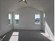 Spacious main bedroom with vaulted ceiling, large windows, and plush carpeting at 1021 Prominence Dr., Homesite 20, Durham, NC 27712