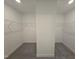 Walk-in closet with carpet and shelving system at 1021 Prominence Dr., Homesite 20, Durham, NC 27712