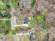 An aerial view of the neighborhood with a beautiful home, green spaces, and nearby roads at 109 Chatterson Dr, Raleigh, NC 27615