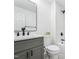 Bright bathroom features a gray vanity, sleek black fixtures, and a tiled shower at 109 Chatterson Dr, Raleigh, NC 27615