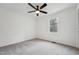 This bedroom offers natural light with a ceiling fan and neutral carpet at 109 Chatterson Dr, Raleigh, NC 27615