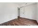Neutral bedroom featuring hardwood floors, white walls, and minimal décor at 109 Chatterson Dr, Raleigh, NC 27615