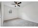 Bedroom featuring a ceiling fan, neutral carpeting, and a large window at 109 Chatterson Dr, Raleigh, NC 27615