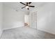 Bedroom featuring a ceiling fan, neutral carpeting, and a closet at 109 Chatterson Dr, Raleigh, NC 27615