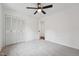 Bedroom featuring neutral carpet, a ceiling fan, and closet for storage at 109 Chatterson Dr, Raleigh, NC 27615