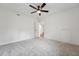 Bedroom featuring a ceiling fan, neutral carpeting, and a view to another room at 109 Chatterson Dr, Raleigh, NC 27615