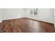 Bright bedroom with hardwood floors and a large window at 109 Chatterson Dr, Raleigh, NC 27615