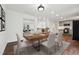 Dining room with wood table and chairs, with easy access to the kitchen at 109 Chatterson Dr, Raleigh, NC 27615