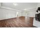 Large living area with a fireplace, hardwood floors, and sliding glass doors to the yard at 109 Chatterson Dr, Raleigh, NC 27615