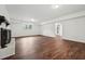 Living area features a fireplace, wood floors, and access to other rooms at 109 Chatterson Dr, Raleigh, NC 27615