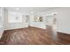 Spacious open-concept living room featuring hardwood floors and bright lighting at 109 Chatterson Dr, Raleigh, NC 27615