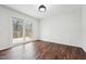 Inviting living room boasts wood floors and sliding glass doors to an outdoor deck at 109 Chatterson Dr, Raleigh, NC 27615