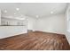 Spacious open-concept living room featuring hardwood floors and bright lighting at 109 Chatterson Dr, Raleigh, NC 27615