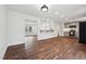 Spacious open-concept living room featuring hardwood floors and bright lighting at 109 Chatterson Dr, Raleigh, NC 27615