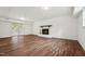 Spacious living room featuring a fireplace, hardwood floors, and sliding glass doors at 109 Chatterson Dr, Raleigh, NC 27615