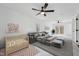 A bright and spacious bedroom features a king bed, ceiling fans, and access to a private balcony at 109 Chatterson Dr, Raleigh, NC 27615