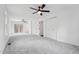 Expansive main bedroom featuring carpet, a fan, and access to a private outdoor deck at 109 Chatterson Dr, Raleigh, NC 27615