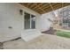 A view of the outdoor patio with concrete flooring, stairs, and a door to enter the home at 109 Chatterson Dr, Raleigh, NC 27615