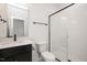 This is a bathroom with a black cabinet, black hardware, white subway tile in the shower, and patterned floors at 1205 Porters Call Dr, Wendell, NC 27591