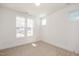 Bedroom with two windows offering bright natural light and neutral carpet at 1205 Porters Call Dr, Wendell, NC 27591