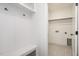 Mud room with coat hooks, a bench, and access to the laundry area at 1205 Porters Call Dr, Wendell, NC 27591