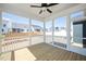 Covered porch featuring wood floors, screen windows and a ceiling fan at 1205 Porters Call Dr, Wendell, NC 27591