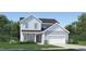 Charming two-story home with blue siding, white trim, a two-car garage and a well-maintained lawn at 140 Hanover Dr, Sanford, NC 27330